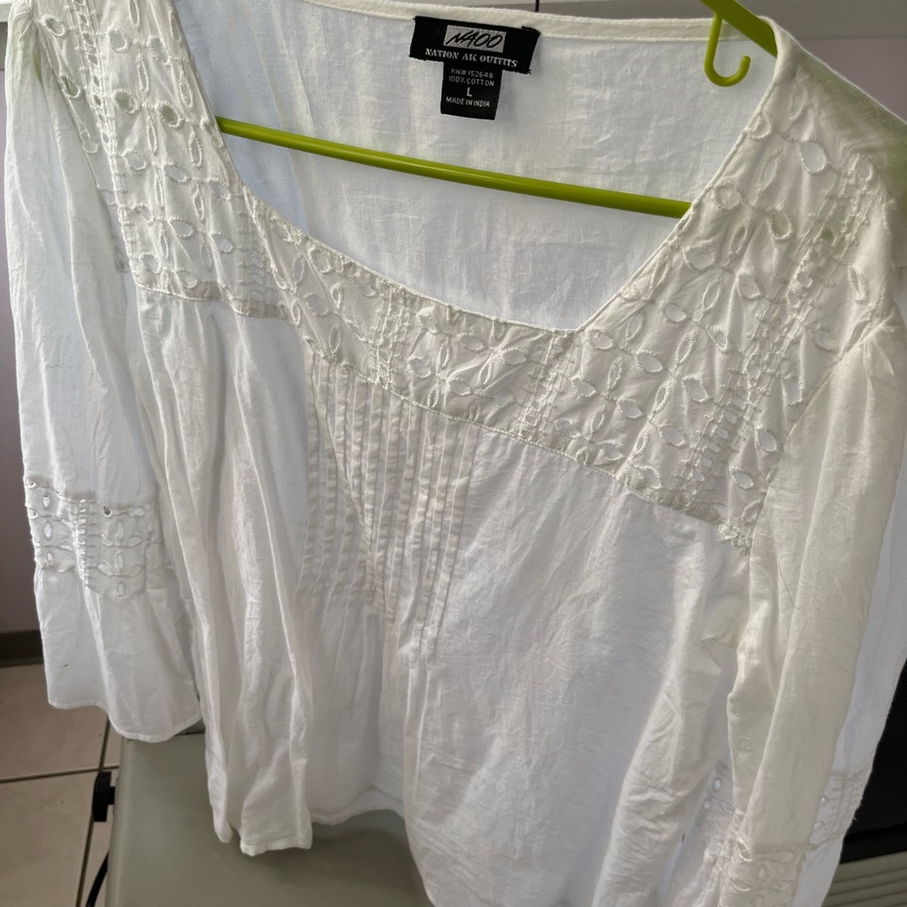 White eyelet top. Bell bottom sleeve